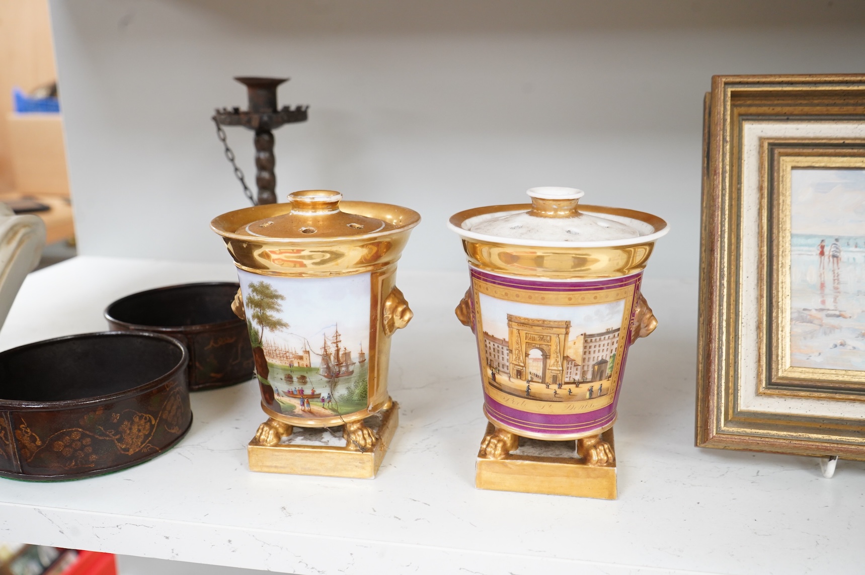 Two early 19th century Paris porcelain pastel burners and covers, decorated with continental landscapes, 15cm high